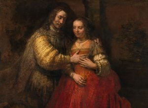 Rembrandt – A zsidó menyasszony c. festménye. Figyeld meg a férfi ruhaujján a különleges lazúros impasztó technikát. Nagyításért kattints a képre! 